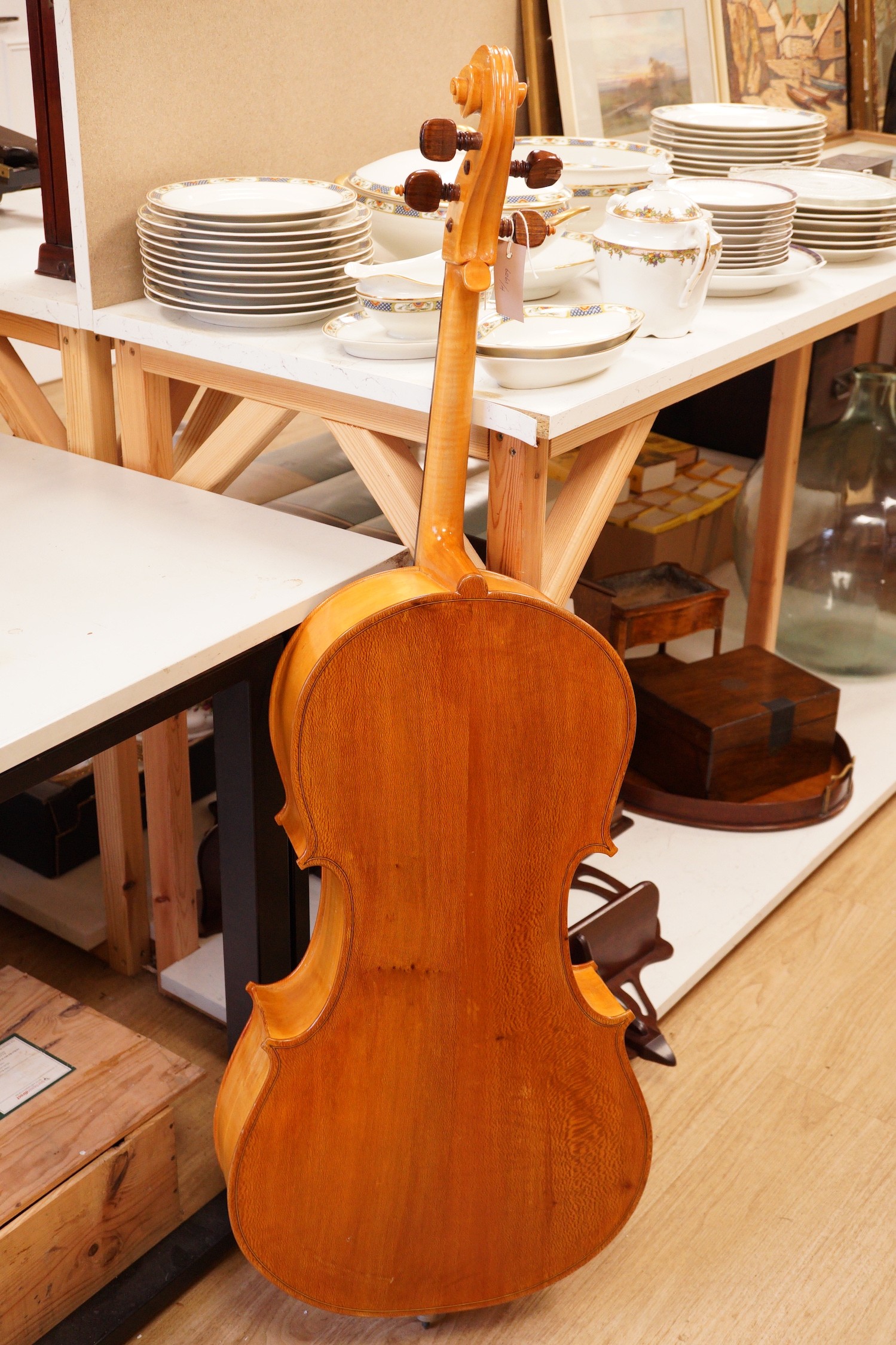 A cello and bow, back measures 73cm